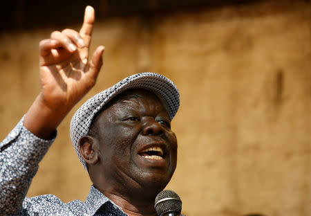 FILE PHOTO: Opposition Movement for Democratic Change leader Morgan Tsvangirai addresses a crowd gathered outside parliament in Harare, Zimbabwe, November 21, 2017. REUTERS/Mike Hutchings/File Photo