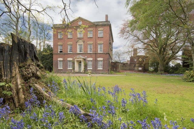 The grand frontage of the manor house