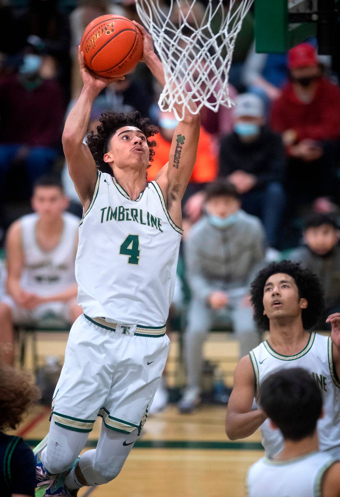 Timberline Brooklyn Hicks flies to the basket against the Todd Beamer Titans during Saturday night’s West Central III/Southwest bidistrict tournament boys basketball opening-round game at Timberline High School in Lacey, Washington, on Feb. 12, 2022. Timberline won the game, 70-40. Tony Overman/toverman@theolympian.com