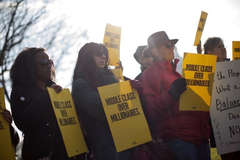 Demonstrators hit Capitol Hill in Washington on December 28, 2012. With the clock ticking toward a New Year's time bomb of huge tax increases and spending cuts, US lawmakers worked feverishly Saturday to keep America from tumbling off that so-called fiscal cliff