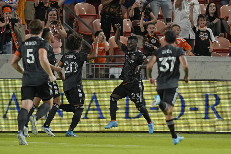 Houston Dynamo's Carlos Darwin Quintero (23) celebrates with teammates after scoring on a penalty kick against the Nashville SC during the second half of a soccer match Saturday, May 14, 2022, in Houston. (AP Photo/David J. Phillip)