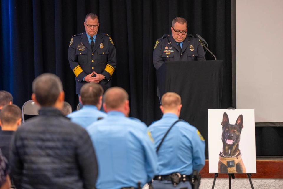 Sedgwick County Sheriff Jeff Easter, left, and Lt. Clayton Bush bow their heads during a moment of silence during a service honoring fallen Sedgwick County Sheriff’s Office K-9 Bane. Bane was killed on Nov. 16, 2023, after he was sent into a drainage pipe in an effort to apprehend a suspect.