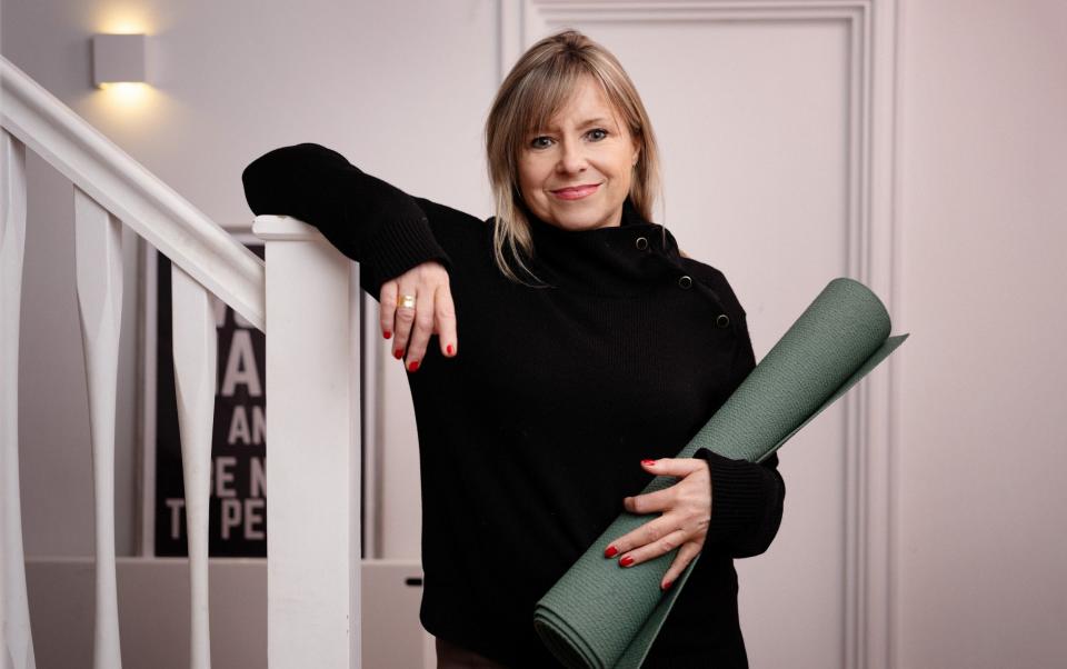 Lysanne Currie with yoga mat