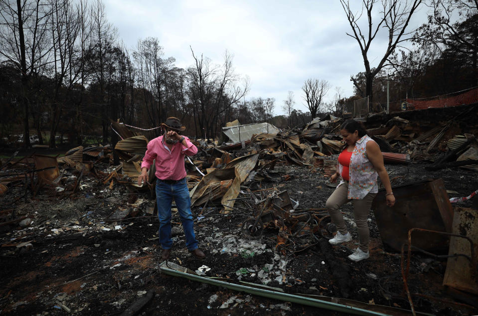 CANBERRA, Jan. 18, 2020 -- Photo taken on Jan. 18, 2020 shows a man shedding tears on the property ruins left by the bushfire in Mogo town, a two-hour drive from Canberra, Australia. At least 28 people have lost their lives and more than 2,000 homes been destroyed across the country in this bushfire season in Australia. (Photo by Chu Chen/Xinhua via Getty) (Xinhua/Chu Chen via Getty Images)