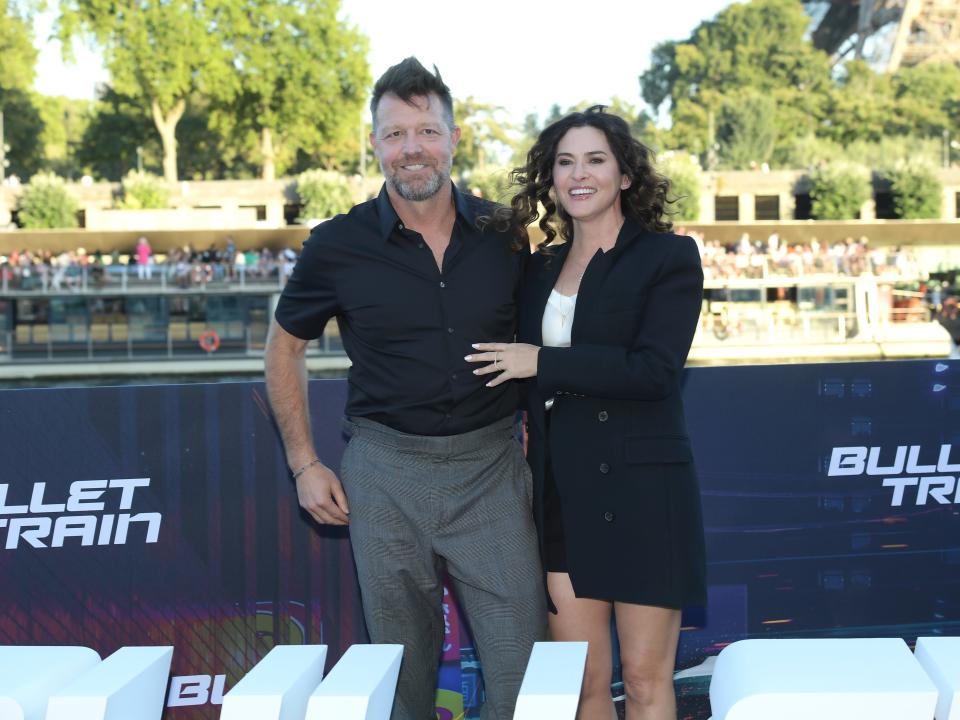 David Leitch standing next to Kelly McCormick