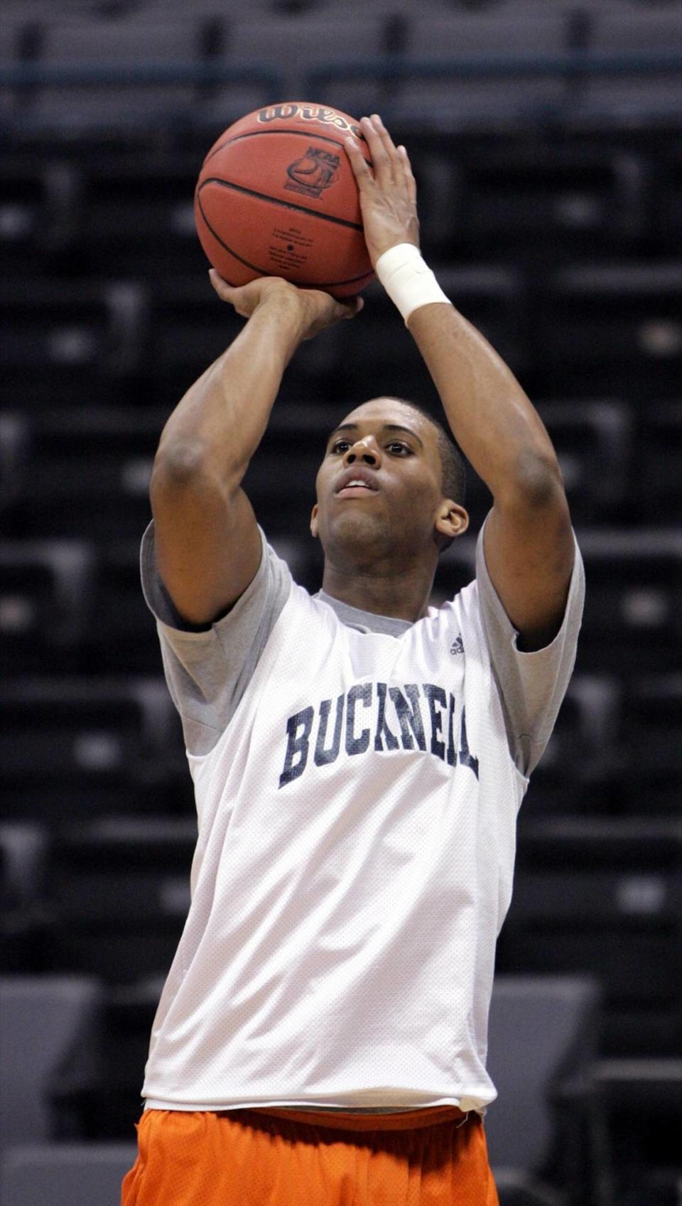 Bucknell guard Charles Lee (3) takes a warmup shot in 2005. In the mid-2000s, Lee was a star for Bucknell and led the team to the only two NCAA Tournament wins it has ever had before beginning his coaching career.