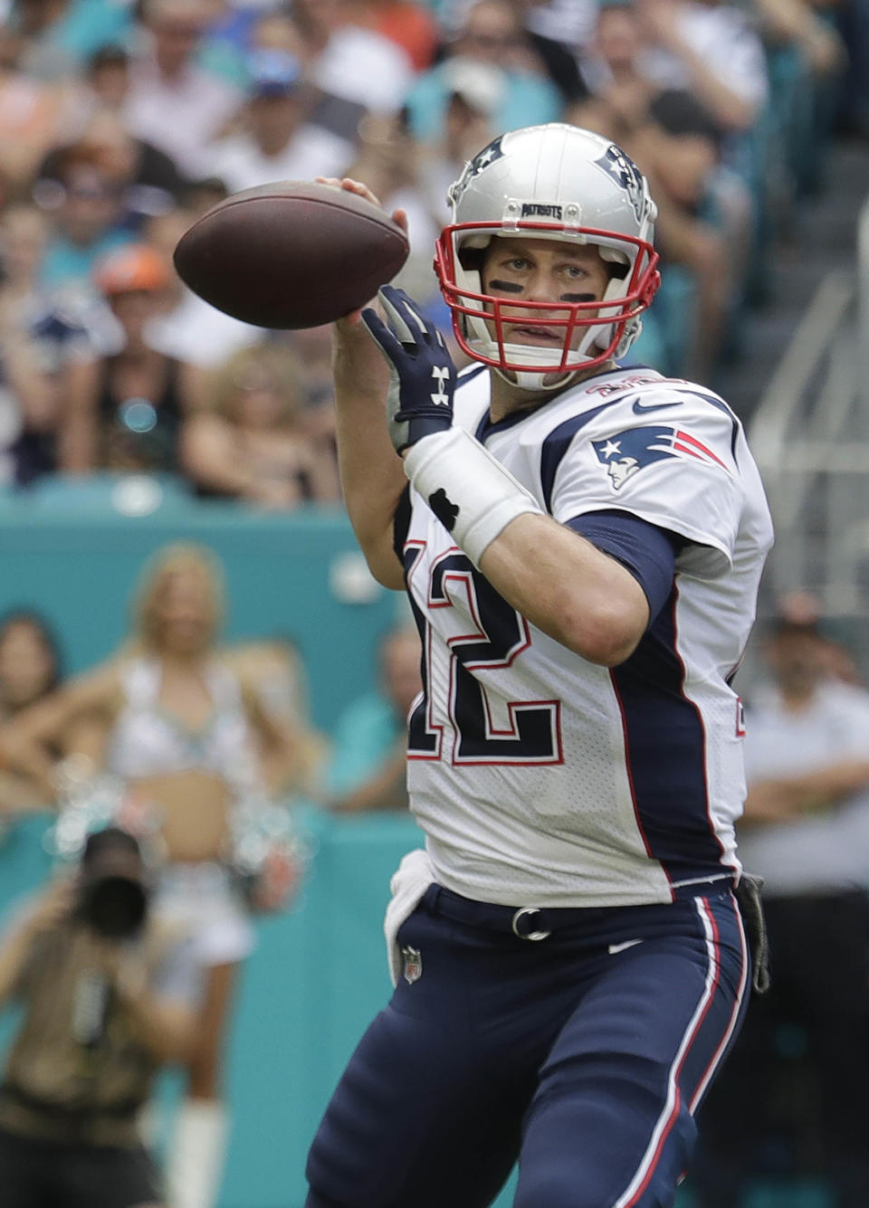 New England Patriots quarterback Tom Brady (12) look to pass, during the first half of an NFL football game against the Miami Dolphins, Sunday, Dec. 9, 2018, in Miami Gardens, Fla. (AP Photo/Lynne Sladky)