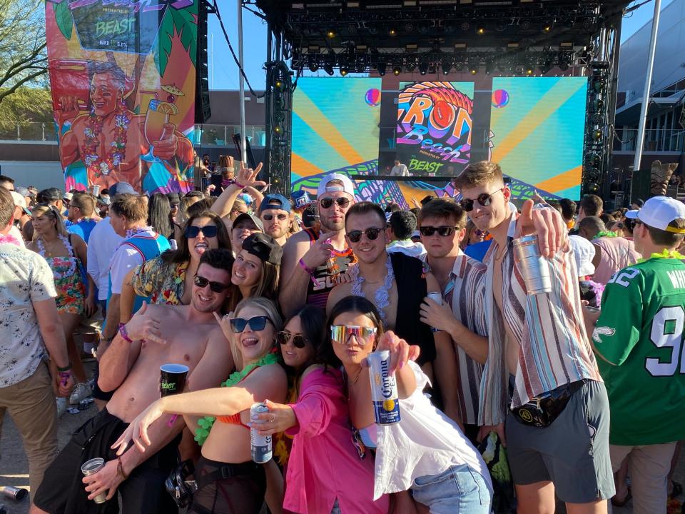 Fans pose for a picture at Gronk Beach.