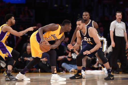 Apr 13, 2016; Los Angeles, CA, USA; Los Angeles Lakers forward Julius Randle (30) looks to drive against Utah Jazz forward Trey Lyles (41) in the first quarter at Staples Center. Mandatory Credit: Robert Hanashiro-USA TODAY Sports / Reuters Picture Supplied by Action Images