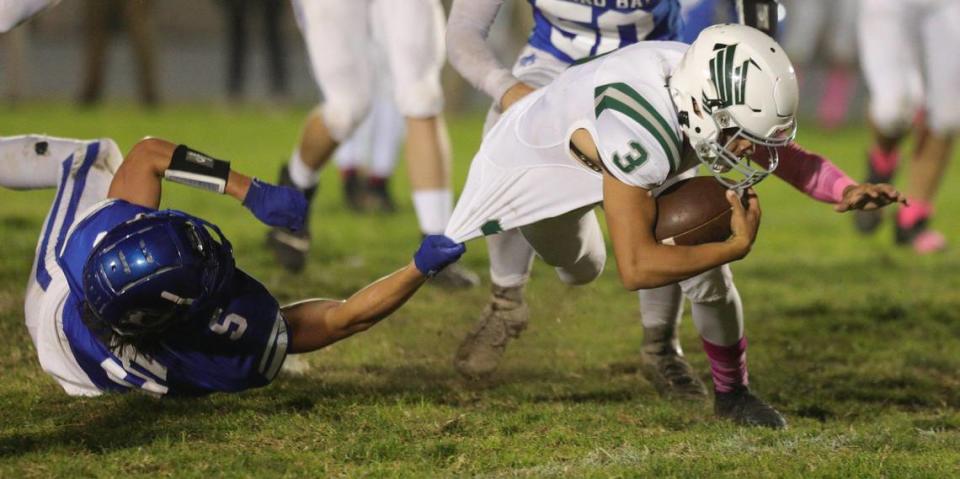 Nami Hoag makes a shirt tackle of Anthony Chavez. Templeton beat Morro Bay 27-9 in an Ocean League football game on Oct. 21, 2022.