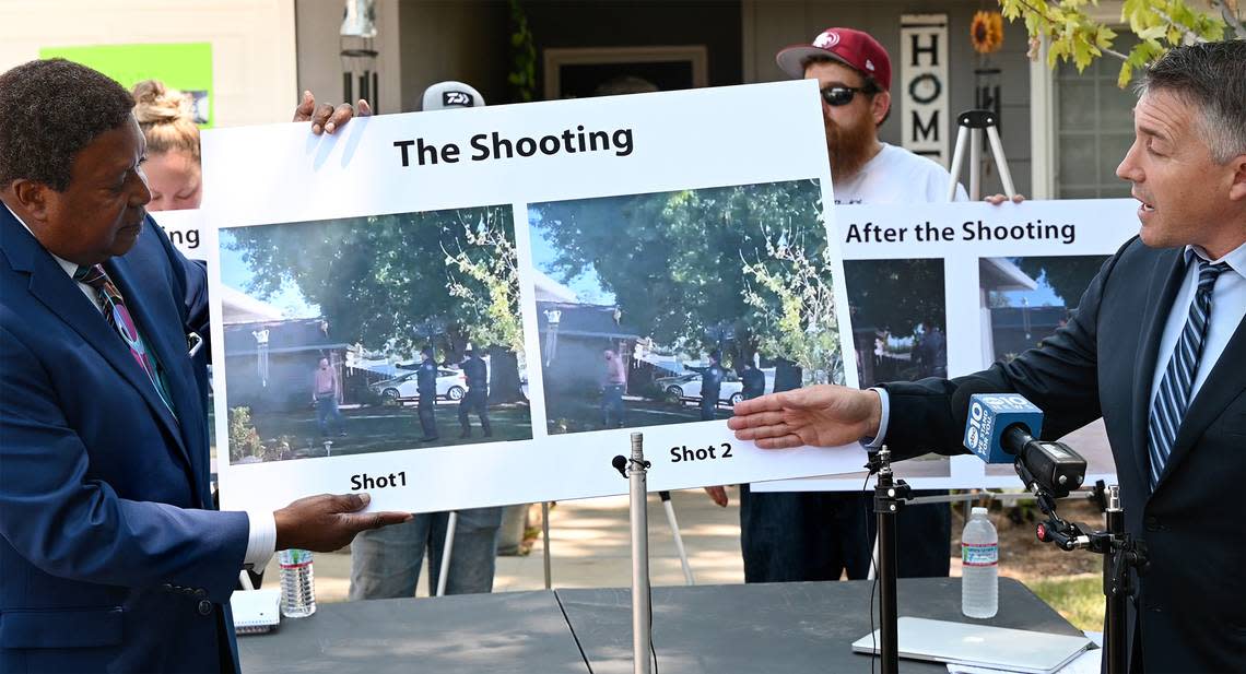 Attorneys Ben Niesenbaum, right, and John Burris, left, show still frames from a cell phone video of the shooting of Paul Chavez Jr. during a news conference to announce a wrongful death lawsuit for the fatal shooting by Modesto Police on July 14. Photographed on Estrada Way in Modesto, Calif., on Tuesday, July 26, 2022.