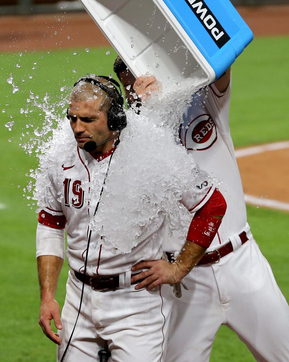 Joey Votto is doused after a walk-off RBI single in 2020