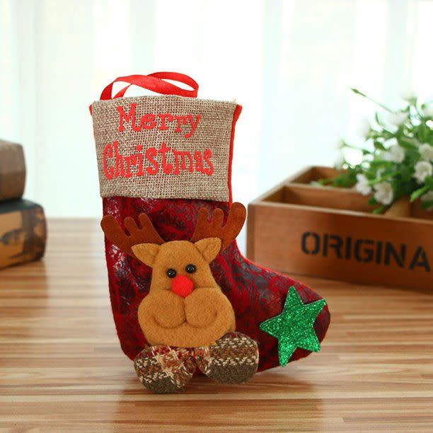 <p><strong>MENRKOO</strong></p><p>walmart.com</p><p><strong>$3.91</strong></p><p>The little one on your gifting list can use this stocking to hold their candy or small treats and presents. When they're done, have them hang it on the tree as an ornament. </p>