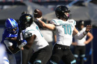 Coastal Carolina quarterback Grayson McCall passes for a touchdown as Georgia State linebacker Jordan Strachan (7) is blocked by offensive lineman Antwine Loper (72) during the first half of an NCAA football game Saturday, Oct. 31, 2020, in Atlanta. (AP Photo/John Amis)
