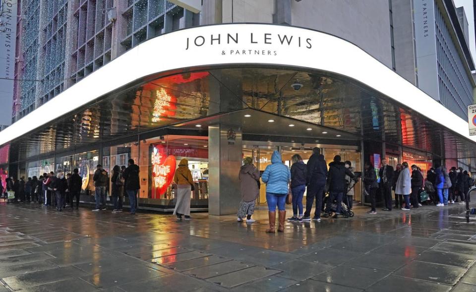 People queuing outside John Lewis on Oxford Street in London on December 27 (Jonathan Brady/PA) (PA Wire)