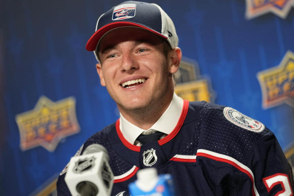 Gavin Brindley smiles as he talks to the media after being picked by the Columbus Blue Jackets during the second round of the NHL hockey draft Thursday, June 29, 2023, in Nashville, Tenn. (AP Photo/George Walker IV)