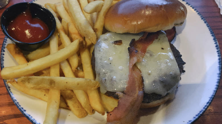 Bacon cheeseburger, ketchup, and fries at Red Lobster