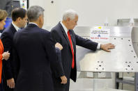 <p>JUL. 6, 2017 – U.S. Vice President Mike Pence touches a piece of hardware with a warning label “Do Not Touch” next to Kennedy Space Center Director Robert Cabana during a tour of the Operations and Checkout Building in Florida. (Photo: Mike Brown/Reuters) </p>