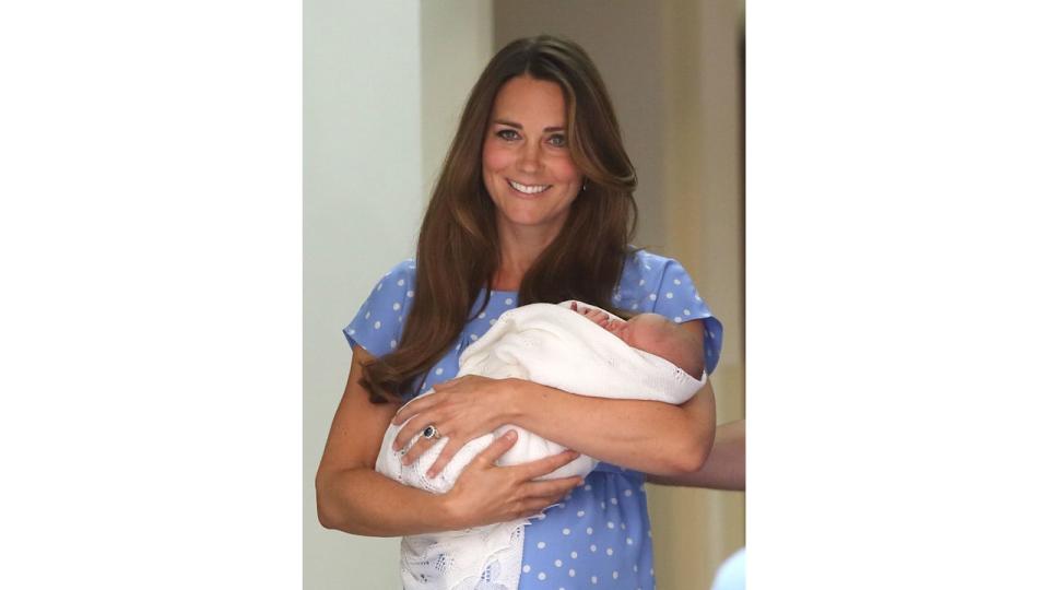 Princess Kate carrying a baby Prince George