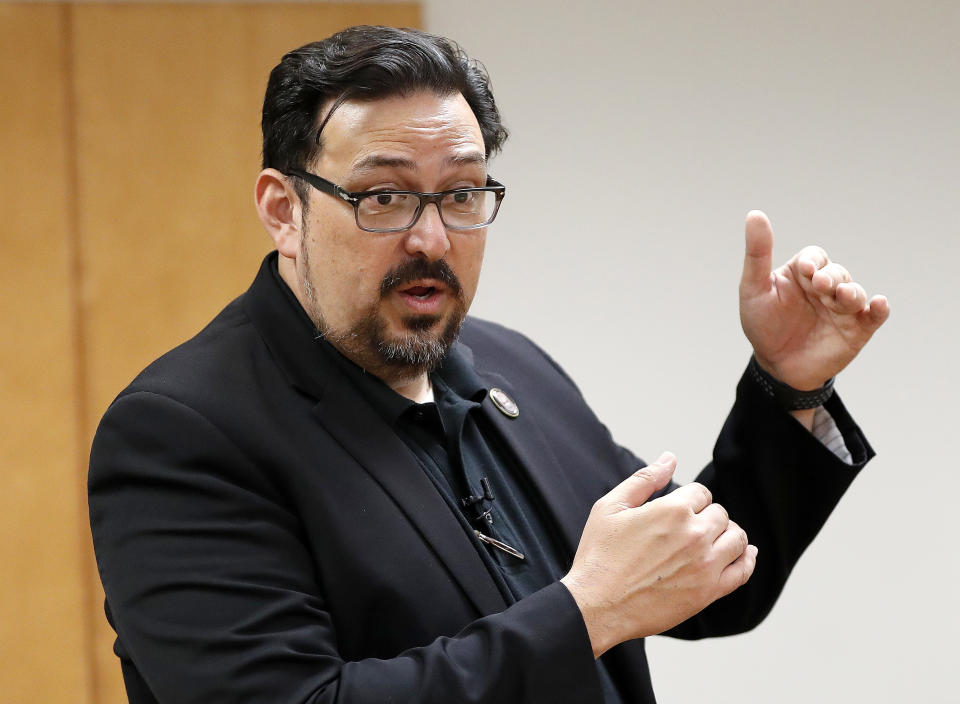 FILE - In this Nov. 6, 2018, file photo, then Maricopa County Recorder Adrian Fontes speaks at the Tabulation and Election Center in Phoenix. Republicans in several key states are imposing voting restrictions this year that Democrats say will disproportionally affect their voters. “When you restrict access by reducing opportunities for voters, you are suppressing the vote for all voters,” said Fontes. “Many of the restrictions being proposed by Republicans are effectively a product of their ignorance of the voting habits of their own constituents.” (AP Photo/Matt York, File)