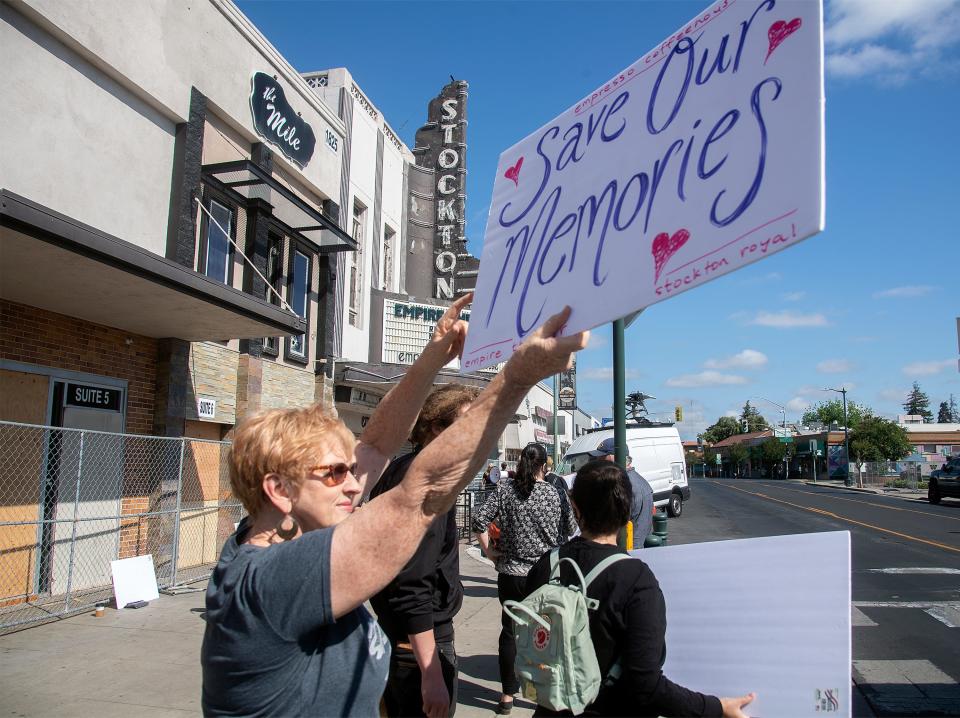 Wendi Maxwell joins in a rally to save the facade of the Empire Theatre on the Miracle Mile in Stockton.