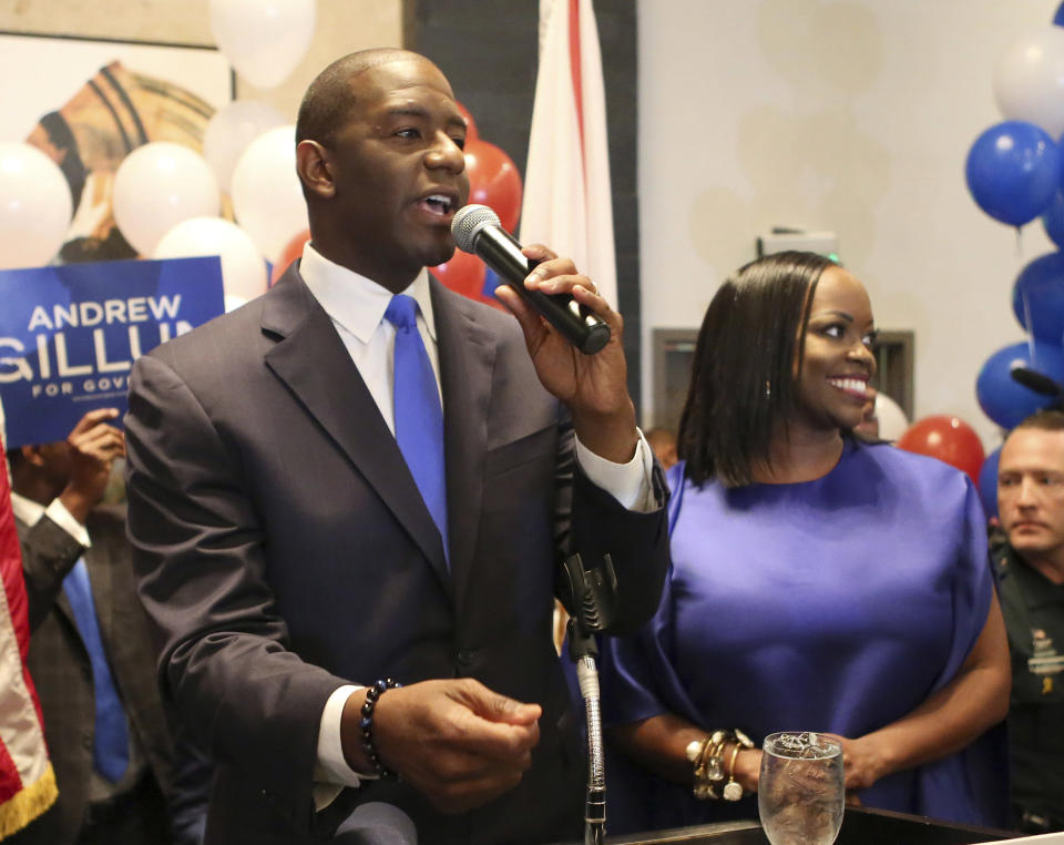 FILE - In this Aug. 28, 2018, file photo, Andrew Gillum and his wife, R. Jai Gillum, address supporters in Tallahassee, Fla. Gillum defeated former U.S. Rep. Gwen Graham and four other candidates. Republicans are taking aim at his tenure as mayor of Tallahassee, including an ongoing FBI investigation into City Hall, that Gillum claims he is not a target. Gillum will face GOP gubernatorial nominee Congressman Ron DeSantis. (AP Photo/Steve Cannon, File)