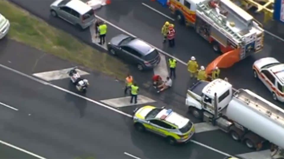 Tamate Heke can be seen sitting in the middle of the road, after an alleged road rage incident that left one man dead. Photo: 7 News