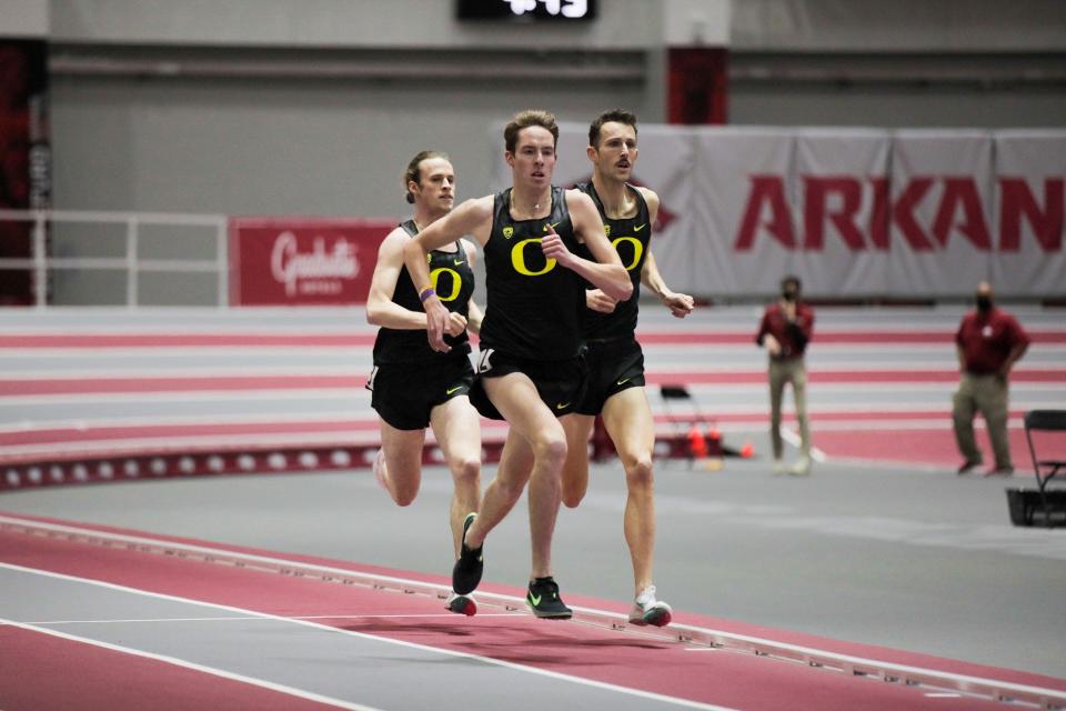 Oregon's Cooper Teare, Cole Hocker (left) and Charlie Hunter (right) race into the record books in the men's mile on Friday.