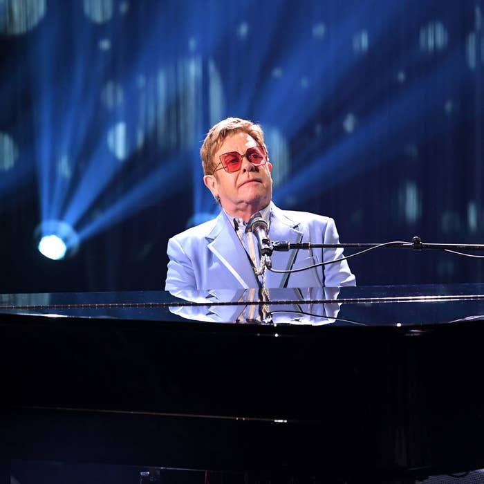 Elton John playing the piano