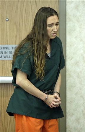 Megan Huntsman enters the courtroom in Provo, Utah April 21, 2014. REUTERS/Rick Bowmer/Pool