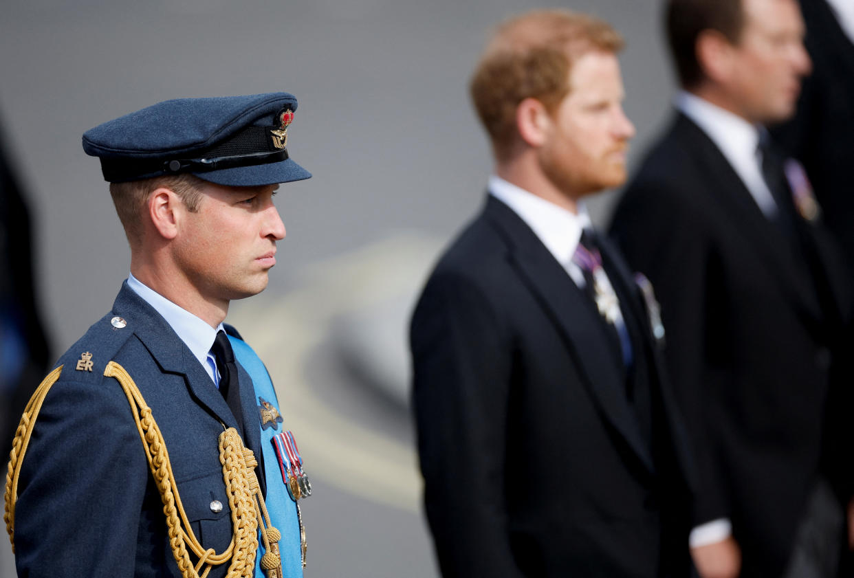 Prince William, Prince of Wales and Prince Harry march during the procession of the coffin of Queen Elizabeth II from Buckingham Palace to the Houses of Parliament for her lying in state in Westminster Hall on September 14, 2022 in London, United Kingdom. Queen Elizabeth II's coffin is taken in procession on a Gun Carriage of The King's Troop Royal Horse Artillery from Buckingham Palace to Westminster Hall where she will lay in state until the early morning of her funeral. Queen Elizabeth II died at Balmoral Castle in Scotland on September 8, 2022, and is succeeded by her eldest son, King Charles III. (Photo by John Sibley - WPA Pool/Getty Images)