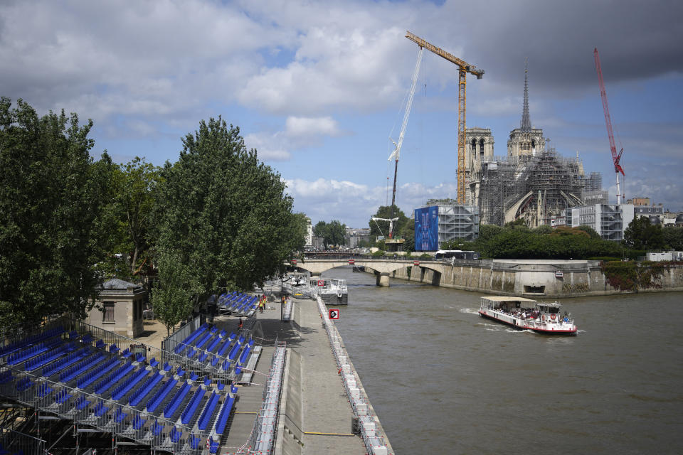 An American swims in Paris' Seine River before the Olympics despite