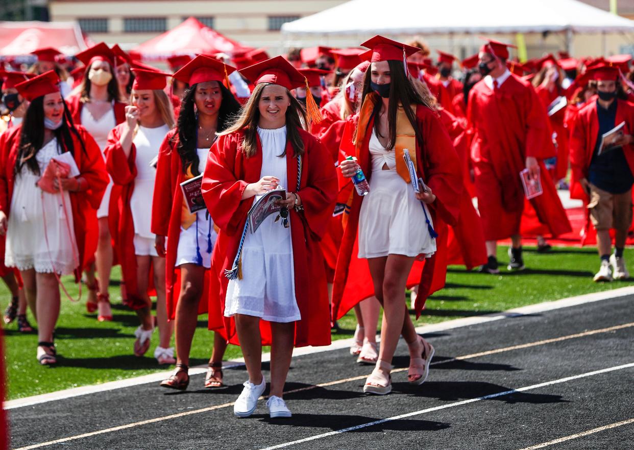 Center Grove High School graduates walk off the field after the 2020 senior graduation at Ray Skillman Stadium at Center Grove High School, Greenwood, Ind., Saturday, July 11, 2020. 