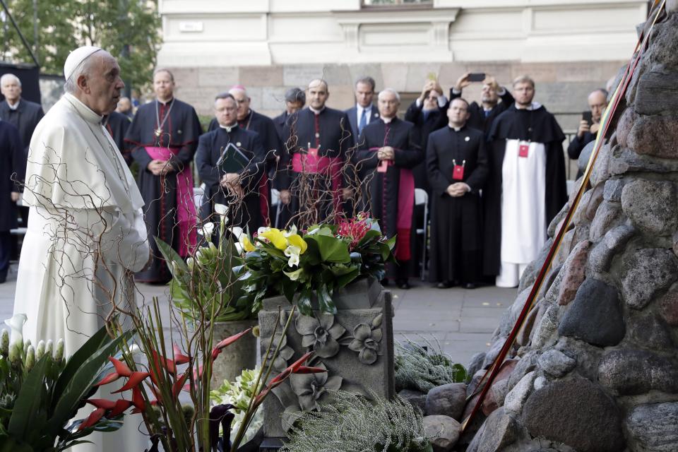 Pope Francis stops for a moment of prayer during his visit to the Museum of Occupations and Freedom Fights, in Vilnius, Lithuania, Saturday, Sept. 22, 2018. Francis began his second day in the Baltics in Lithuania's second city, Kaunas, where an estimated 3,000 Jews survived out of a community of 37,000 during the 1941-1944 Nazi occupation. (AP Photo/Andrew Medichini)