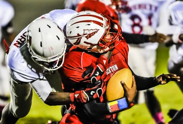 Native American insignia like the arrow on the Lansing Sexton helmet above are safe in Michigan ... for now — AP