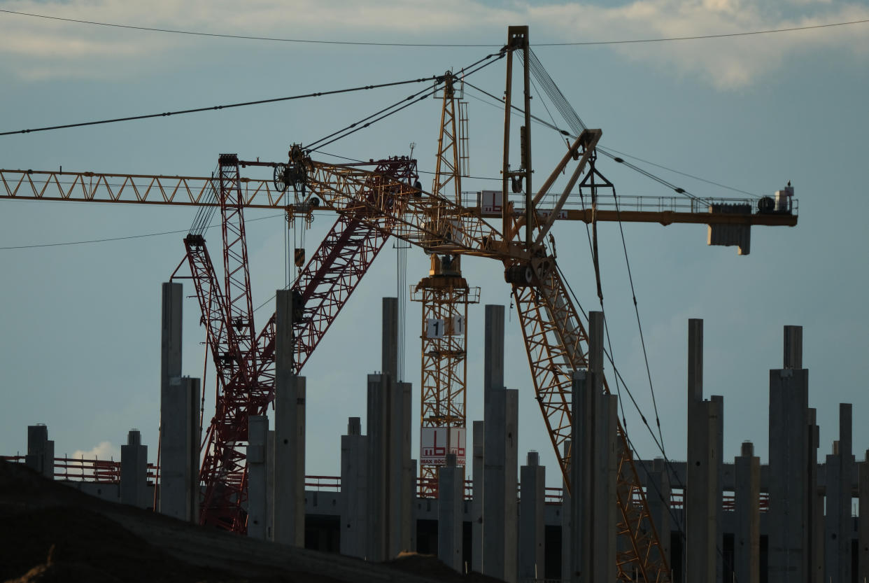GRUENHEIDE, GERMANY - AUGUST 31: Cranes stand at the construction site of the new Tesla Gigafactory near Berlin on August 31, 2020 near Gruenheide, Germany. The factory is scheduled to begin producing Tesla electric cars in the summer of 2021.   (Photo by Sean Gallup/Getty Images)