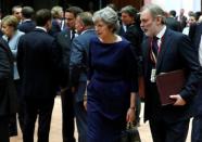 Britain's Prime Minister Theresa May and Britain's permanent representative to the European Union Tim Barrow (R) arrive at an EU summit in Brussels, Belgium October 19, 2017. REUTERS/Yves Herman