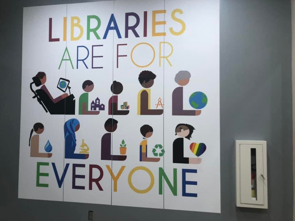 This mural at the Waycross, Ga., branch of the Okefenokee Regional Library System sparked controversy for its inclusion of an LGBTQ+ image.