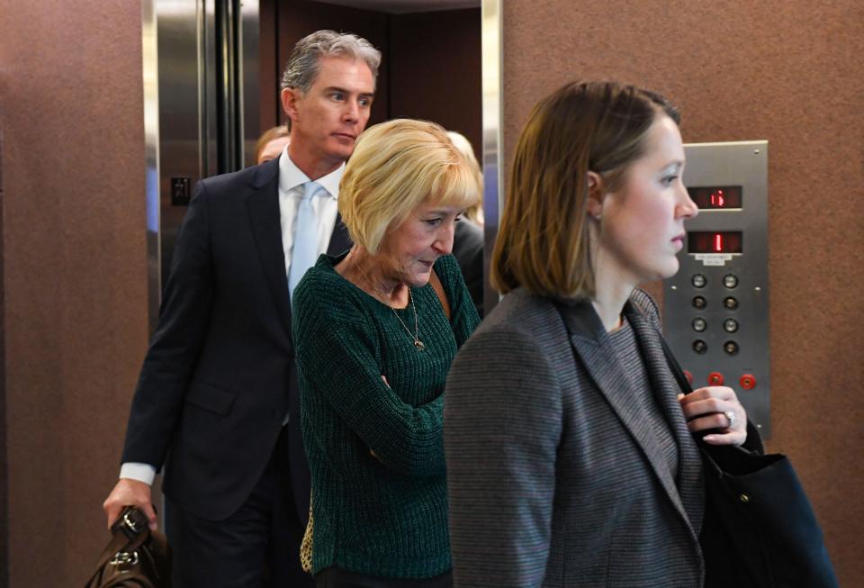 Theresa Bentaas, center, exits after her sentencing hearing on Thursday, December 2, at the Minnehaha County Courthouse in Sioux Falls. She was sentenced to the South Dakota women's prison for 10 years with nine years suspended with credit for time served.