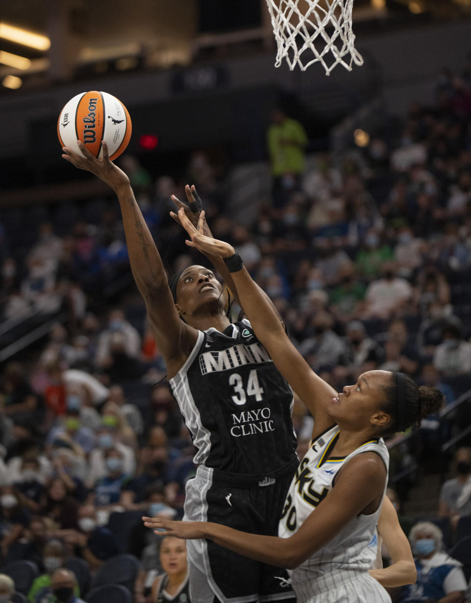 Minnesota Lynx center Sylvia Fowles (34) is fouled by Chicago Sky forward/center Azurá Stevens (30) in the first quarter of a WNBA basketball game, Sunday, Sept. 26, 2021, in Minneapolis. (Jeff Wheeler/Star Tribune via AP)