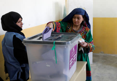 An Afghan woman casts her vote during parliamentary elections at a polling station in Kabul, Afghanistan, October 20, 2018. REUTERS/Mohammad Ismail