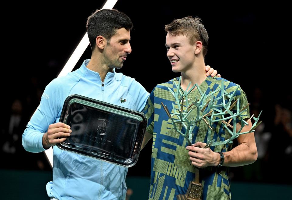 Winner Holger Rune (R) of Denmark and runner up Novak Djokovic (L) of Serbia pose after their men's singles final at the ATP World Tour Masters 1000 - Rolex Paris Masters (Paris Bercy) - indoor tennis tournament at The AccorHotels Arena in Paris, France.