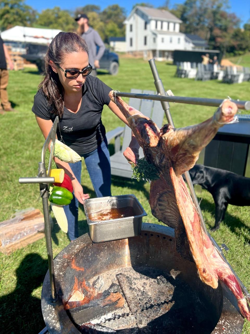 Alexandra Donnadio cooking over open fire.