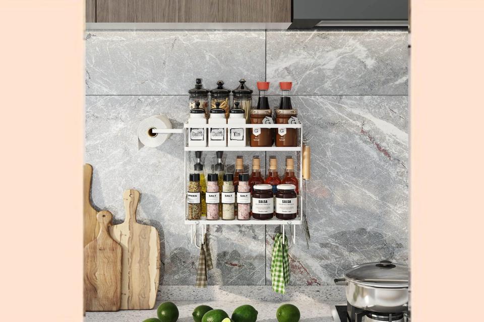 Storage rack hanging on kitchen backsplash.