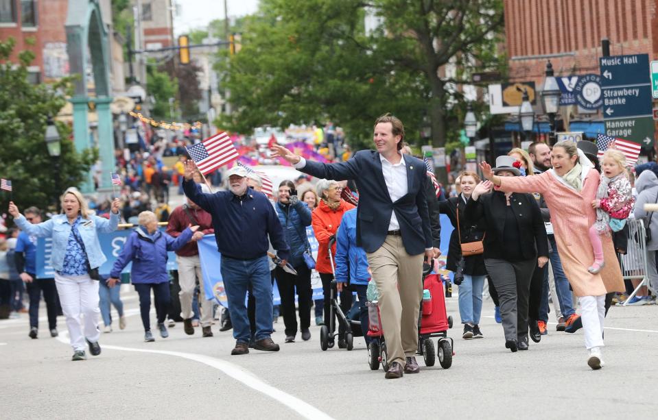 Portsmouth Mayor Deaglan McEachern and his family wave during the city's 400th anniversary parade Saturday, June 3, 2023.