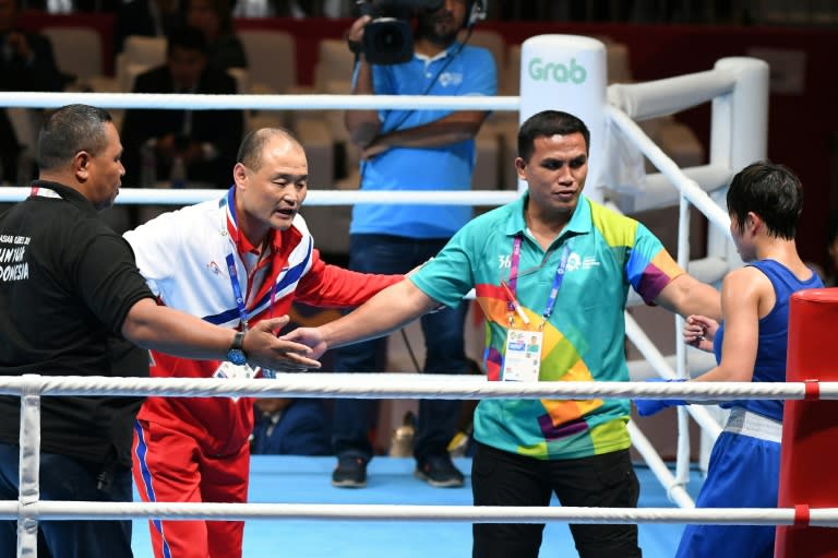 Two North Korean coaches were kicked out of the Asian Games over a protest that saw police called into the ring