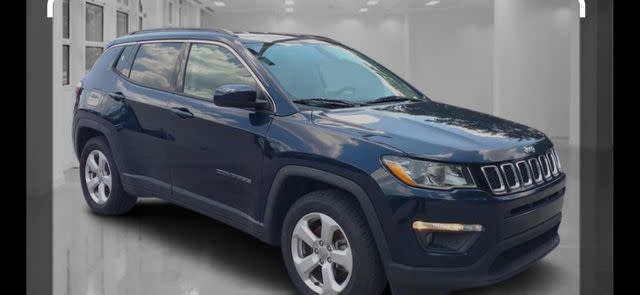 <p>Fairbanks Police Department/Facebook</p> A photo of the dark metallic blue Jeep Compass Bare rented.