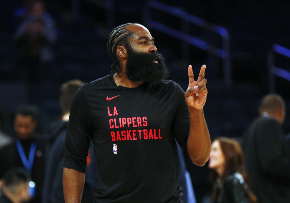 Los Angeles Clippers guard James Harden warms up before an NBA basketball game against the New York Knicks, Monday, Nov. 6, 2023, in New York. (AP Photo/John Munson)