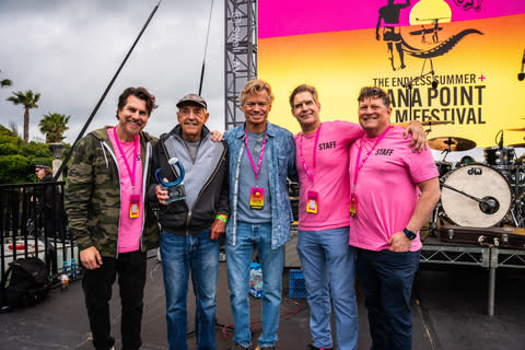 Pictured: Tony Cordova and Alex Mecl, co-founders and CEOs, and Lloyd Bryan Molander, founder and festivals director of the Endless Summer + Dana Point Film Festival, with Dick Metz, the inspiration behind the Endless Summer movie, and Dana Brown, director of Step Into Liquid. (Photo: Business Wire)