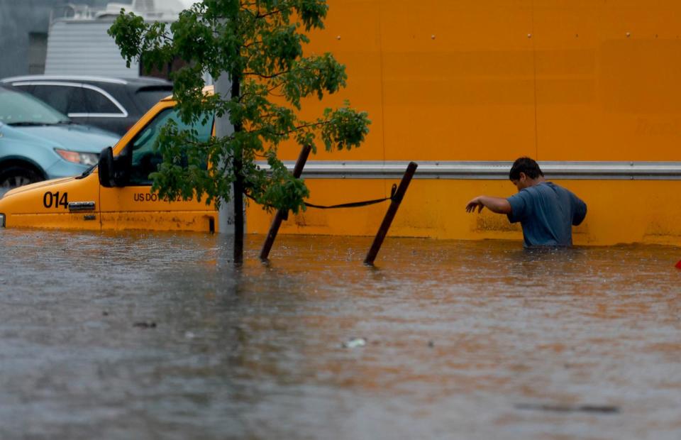 PHOTO: A person walks through a flooded street, June 12, 2024, in Hollywood, Fla. (Joe Raedle/Getty Images)